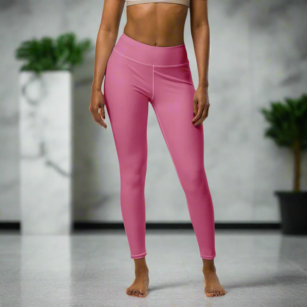 A woman modeling the Petalburn Yoga Leggings in Ritual Rose. High-waisted, long-length yoga leggings featuring UV protection, four-way stretch, and body contouring fit.
