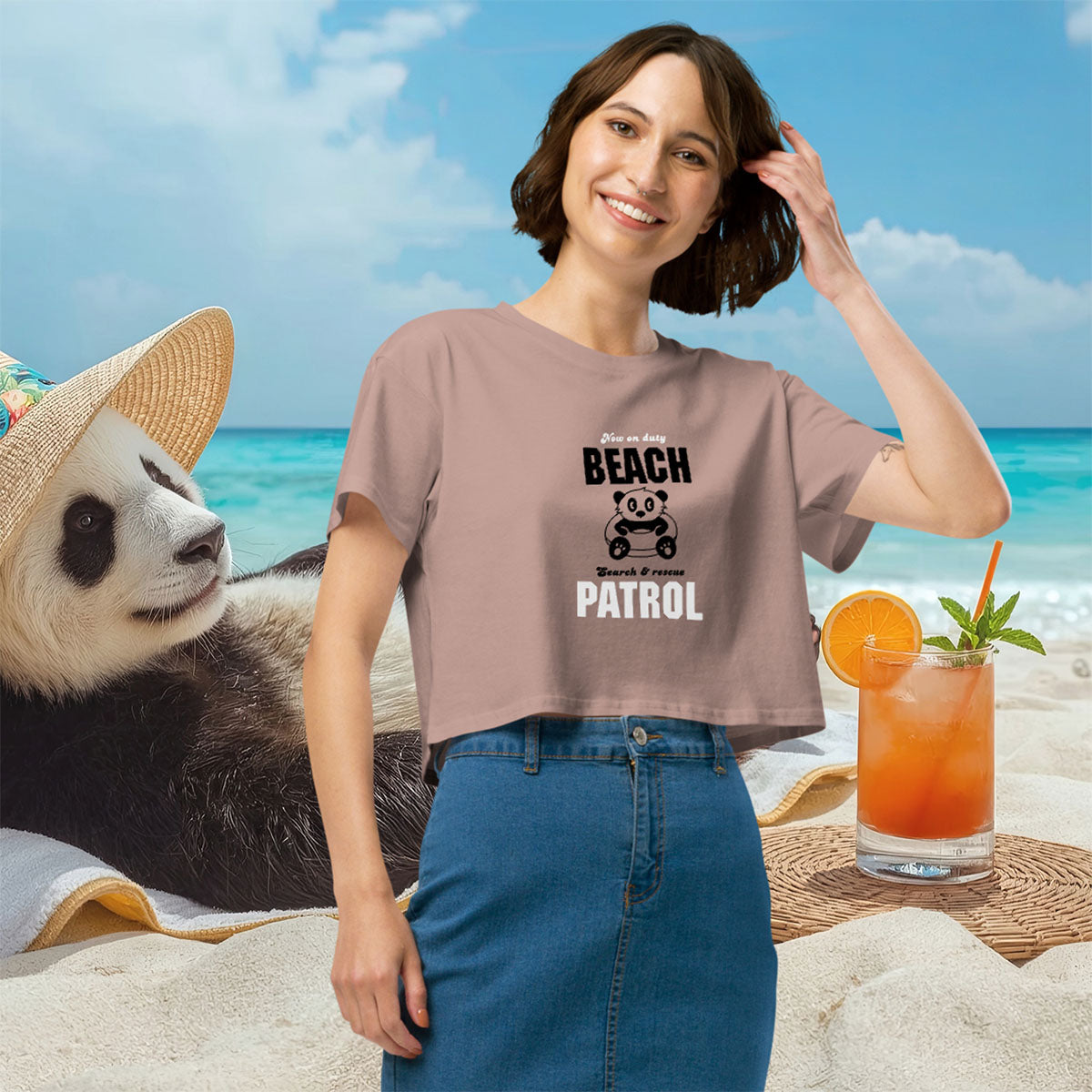 Woman on a beach with a panda and cocktail, wearing a t-shirt with 'Beach Patrol' text.