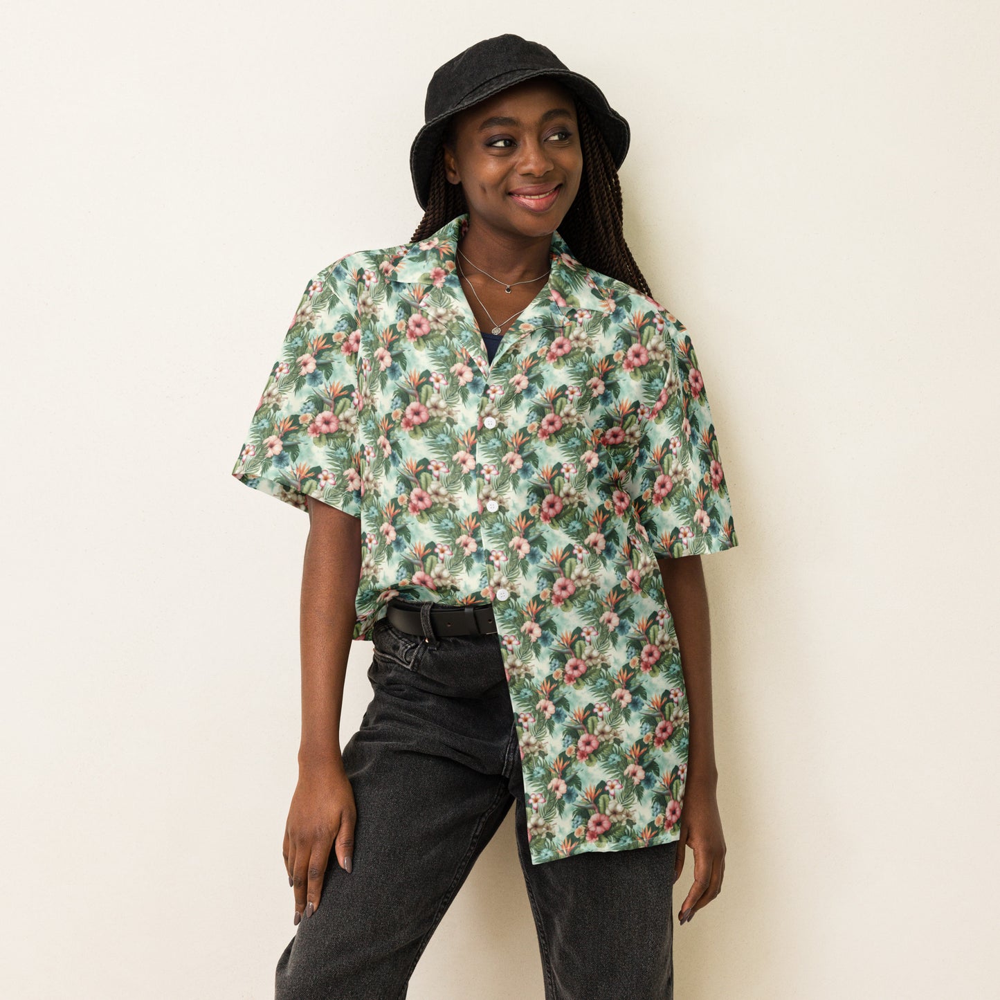Person wearing Unisex Button Shirt in Floral Escape, featuring a beautiful floral print, lightweight and moisture-wicking material, perfect for hot summer days.