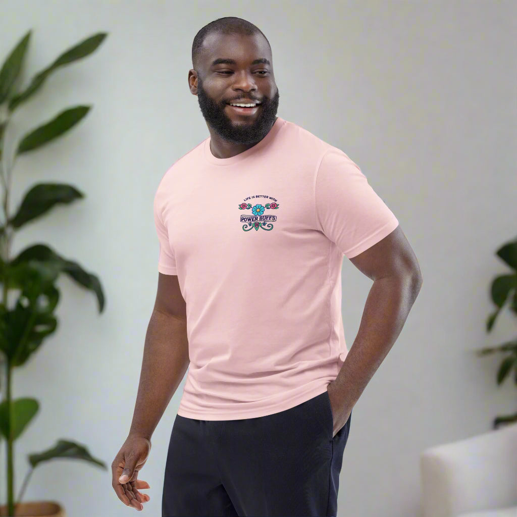 Man wearing a pink cotton T-shirt with the text "Life is Better with Power Buffs," embellished with flowers.