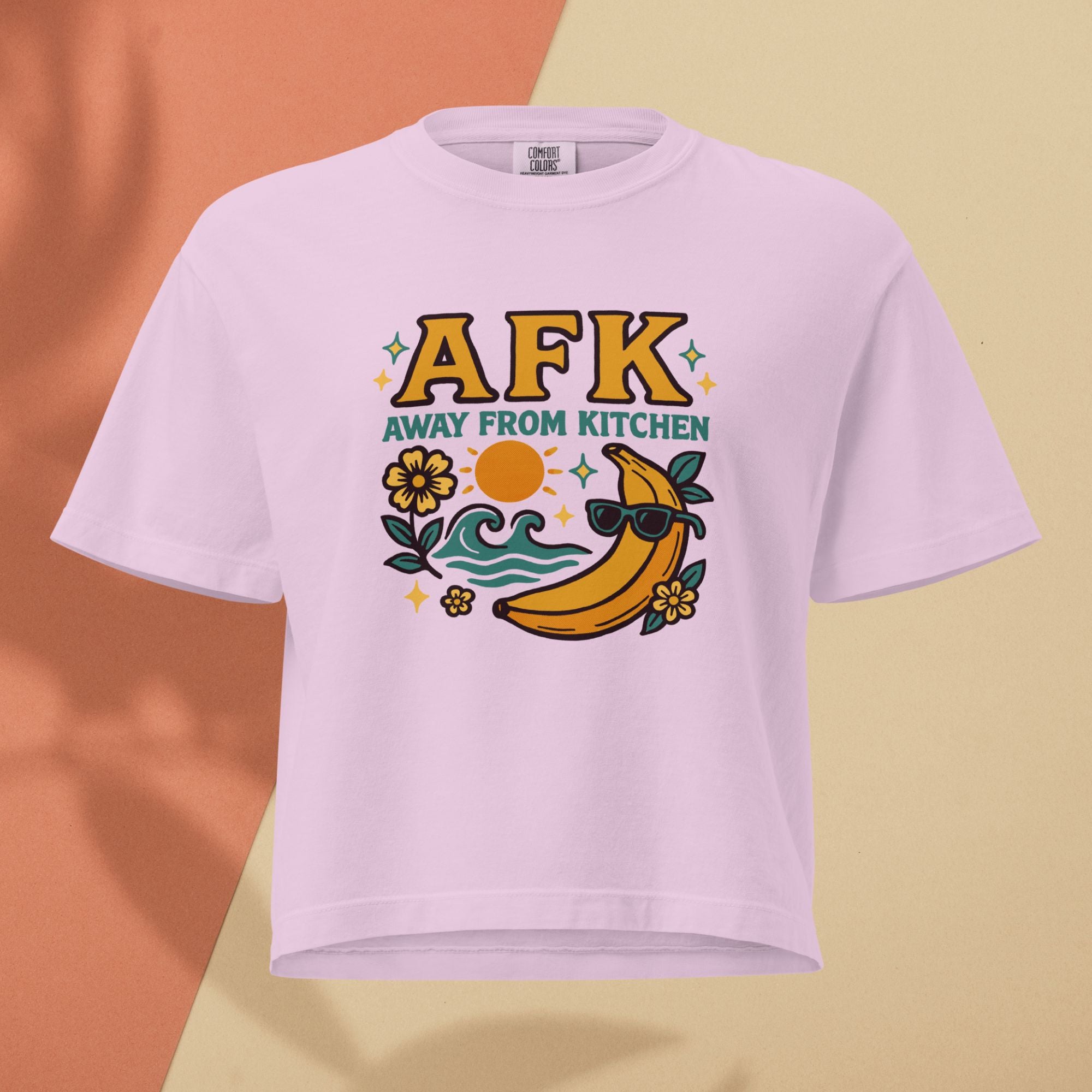 Pink t-shirt with 'AFK Away From Kitchen' graphic on a two-tone background