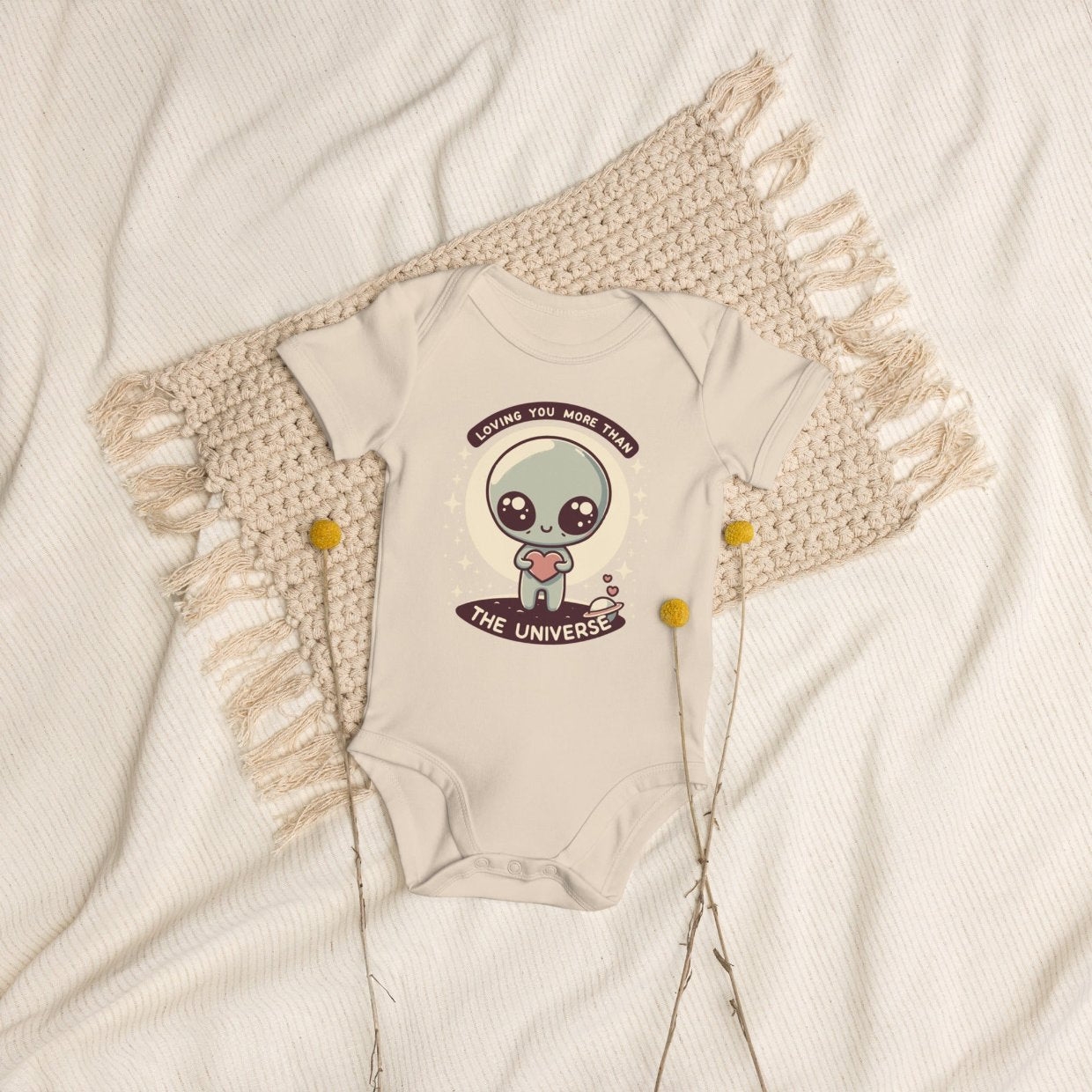 ErdeGora Organic Cotton Baby Bodysuit with a Cute Alien and ‘Loving You More Than The Universe’ text, flat lay, front view