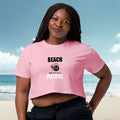 Woman wearing a pink t-shirt with 'Beach Patrol' text on a beach background