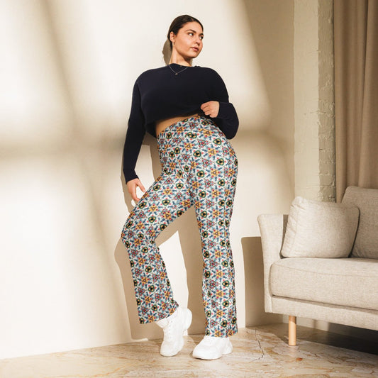 High-rise flared leggings with a vibrant tulips and windmills pattern, featuring a high waist and flared bottoms, worn by a model.