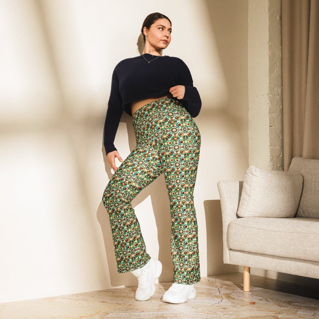 High-rise flared leggings with a woodland-inspired pattern, featuring a high waist and flared bottoms, worn by a model.