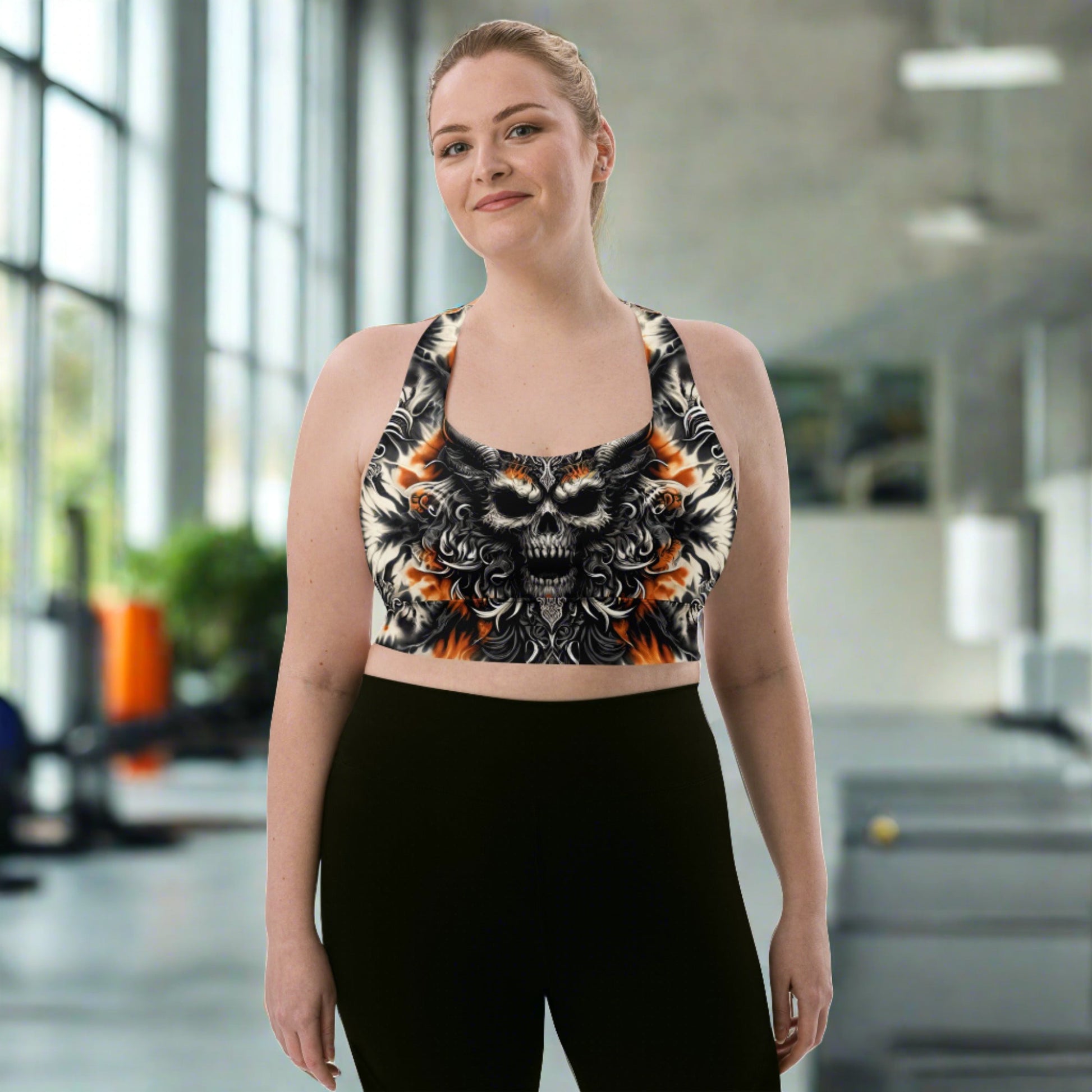 Twilight Flame Longline Sports Bra featuring an intense skull and flame motif in orange and black, designed for fierce workouts and bold style.