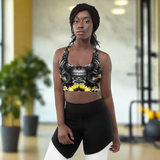 Eclipse Spark Longline Sports Bra featuring a bold skull and floral motif with yellow and white bursts on a black background, ideal for both fitness and fashion-forward styling.