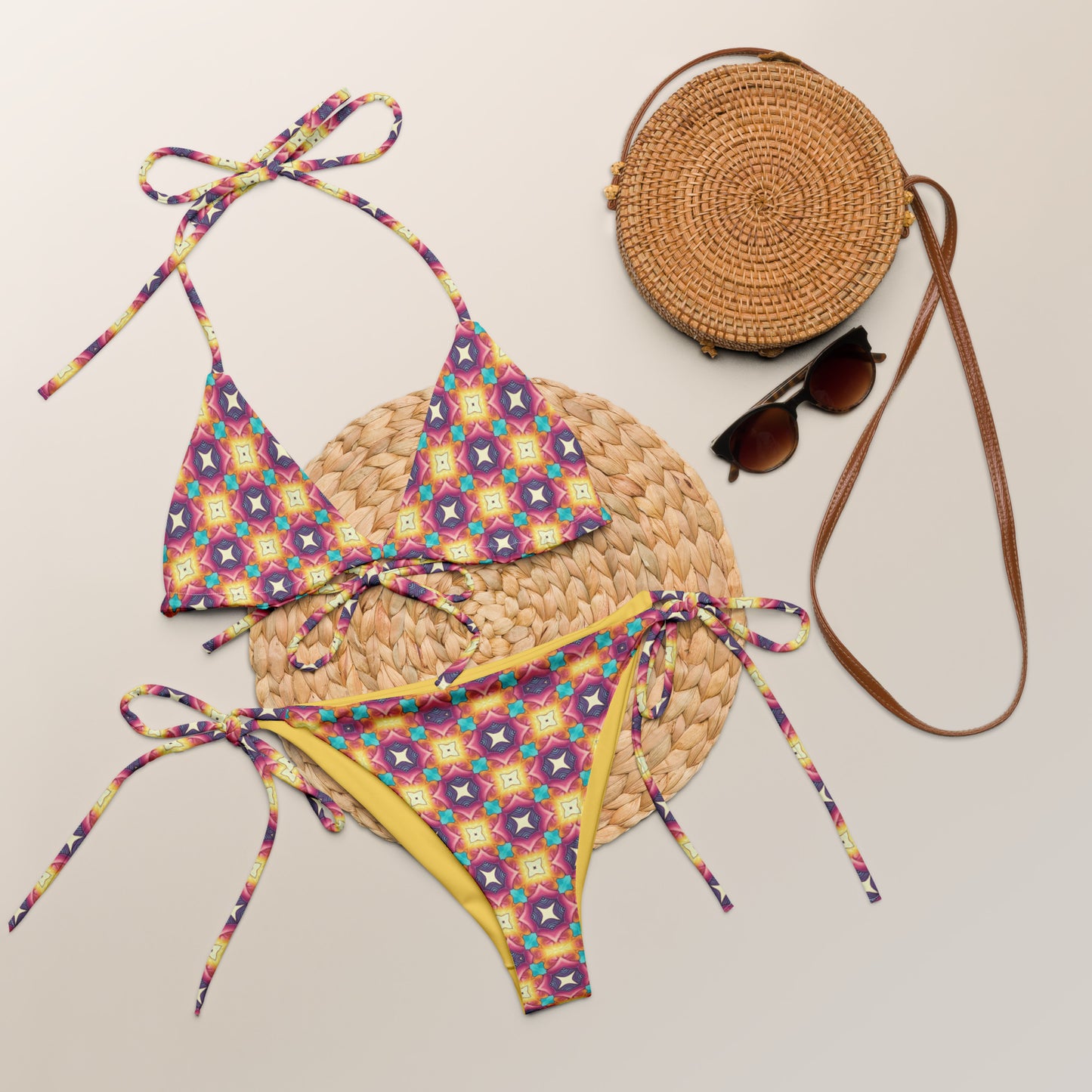 Colorful recycled string bikini with a vibrant kaleidoscope pattern, adjustable ties, and eco-friendly materials.