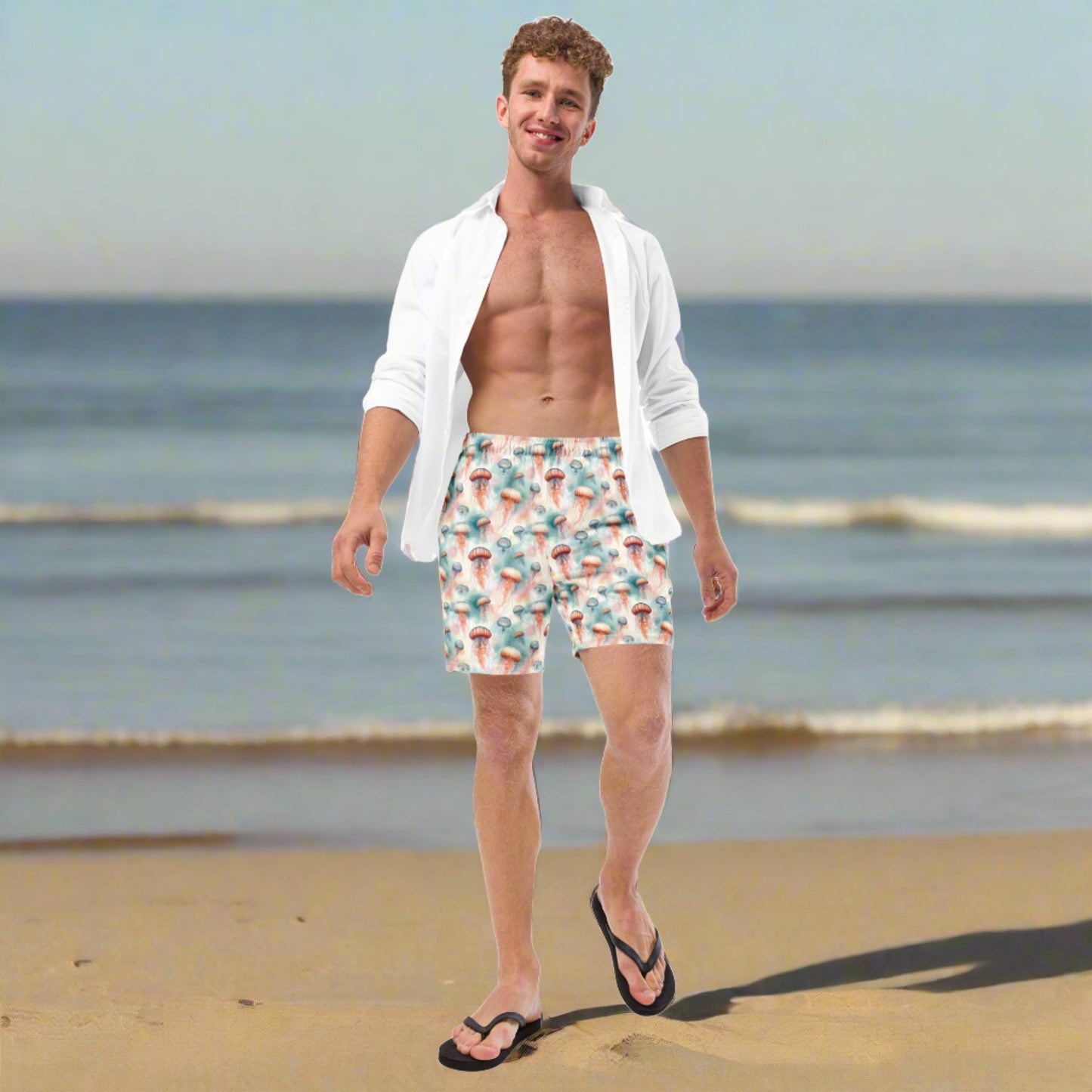 Man wearing Men’s Swim Trunks in Jellyfish Dream, featuring a vibrant jellyfish pattern and adjustable drawstring waist, perfect for summer water activities.