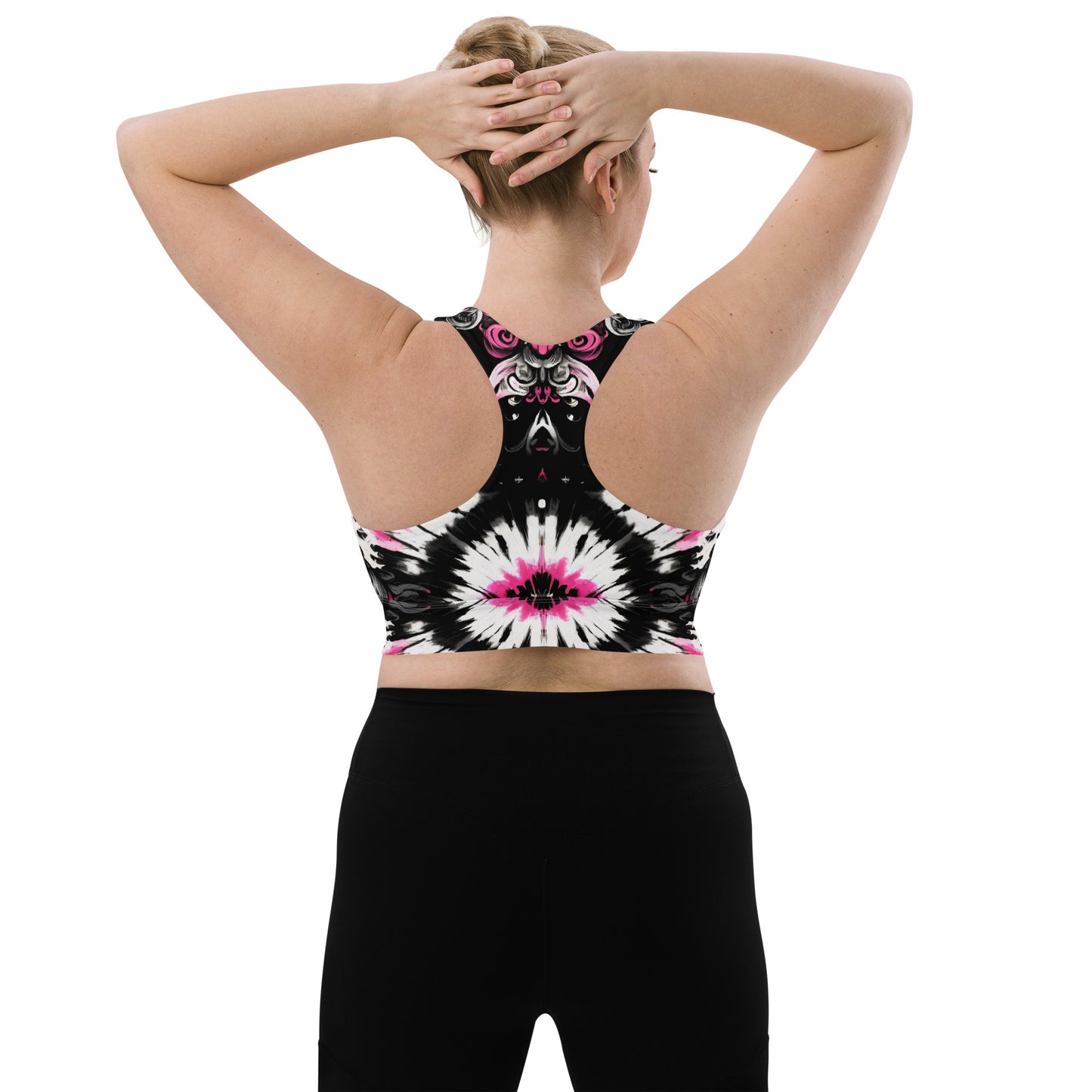 Back view of the Dark Blush Longline Sports Bra showcasing a racerback design with reinforced straps for high-impact support. Worn by a model holding hands up.