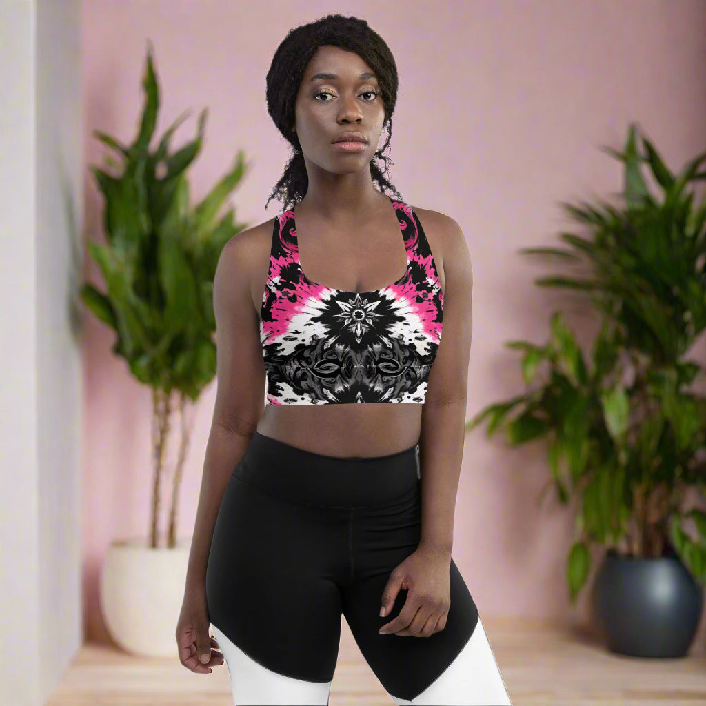 Front view of the Dark Blush Longline Sports Bra featuring a black, white, and pink tie-dye gothic design with a longline cut for extended coverage