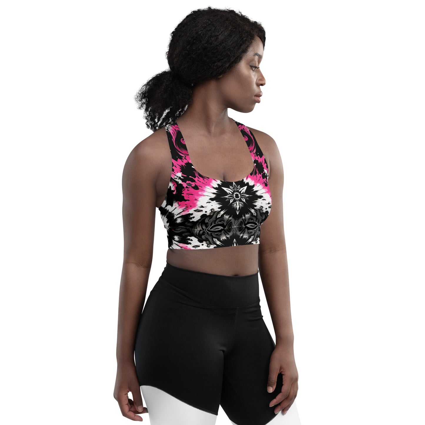 Front view of the Dark Blush Longline Sports Bra featuring a black, white, and pink tie-dye gothic design with a longline cut for extended coverage worn by a model.