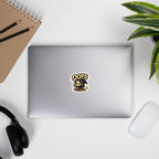 Kiss-cut sticker of an undead rogue dropping out of stealth after a noisy coin lands nearby, shown in the 3 × 3-inch size on a laptop.