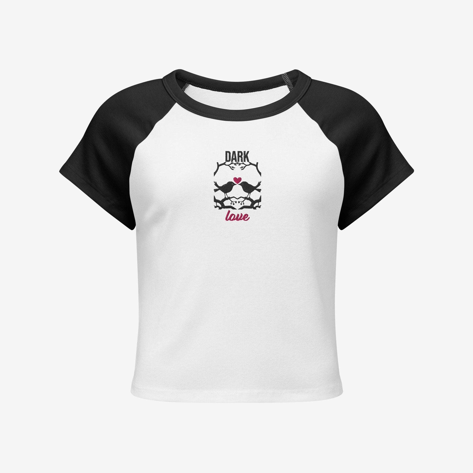 Women’s micro rib raglan baby tee front view, white with black sleeves and embroidered Dark Love birds with heart