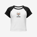 Women’s micro rib raglan baby tee front view, white with black sleeves and embroidered Love Birds heart with text.