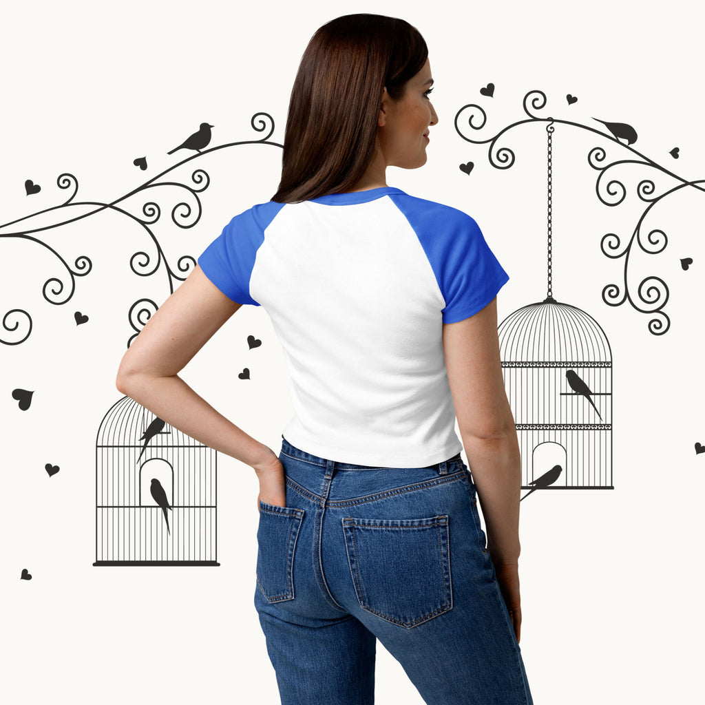 Person wearing a white and blue shirt with decorative elements in the background