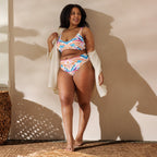 Model wearing Recycled High-Waist Bikini | Peachy Shells, front view, displaying the bikini's curve-loving design and charming shell print.