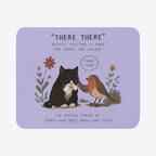 A rectangular mousepad with rounded corners on a light gray background. The mousepad has a lavender purple base and features a cute cartoon illustration of a black and white cat and a robin bird with the text 'THERE THERE' and a humorous quote below.