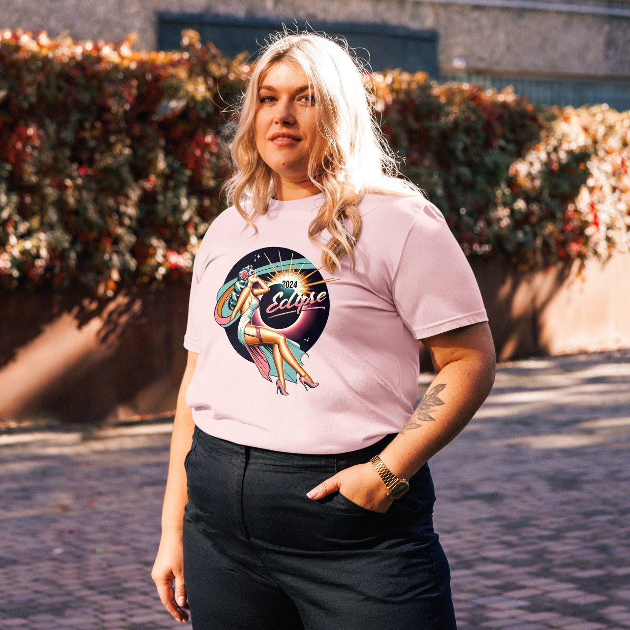 Model wearing ErdeGora's Solar Eclipse 2024 Pink Eco-Friendly Organic Cotton T-Shirt with Retro Lady Design With Eclipse Glasses, close up view 