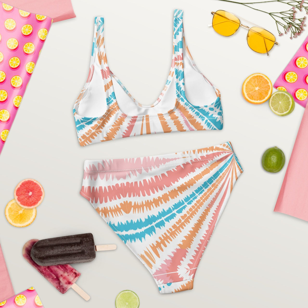 Rear view of Recycled High-Waisted Bikini in Peachy Twister pattern, eco-conscious and chic with a flattering high-rise cut, ready for summer adventures.