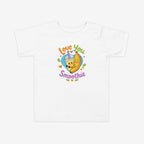 White t-shirt with a colorful 'Love You Smoothie' design featuring a banana and smoothie cup on a white background.