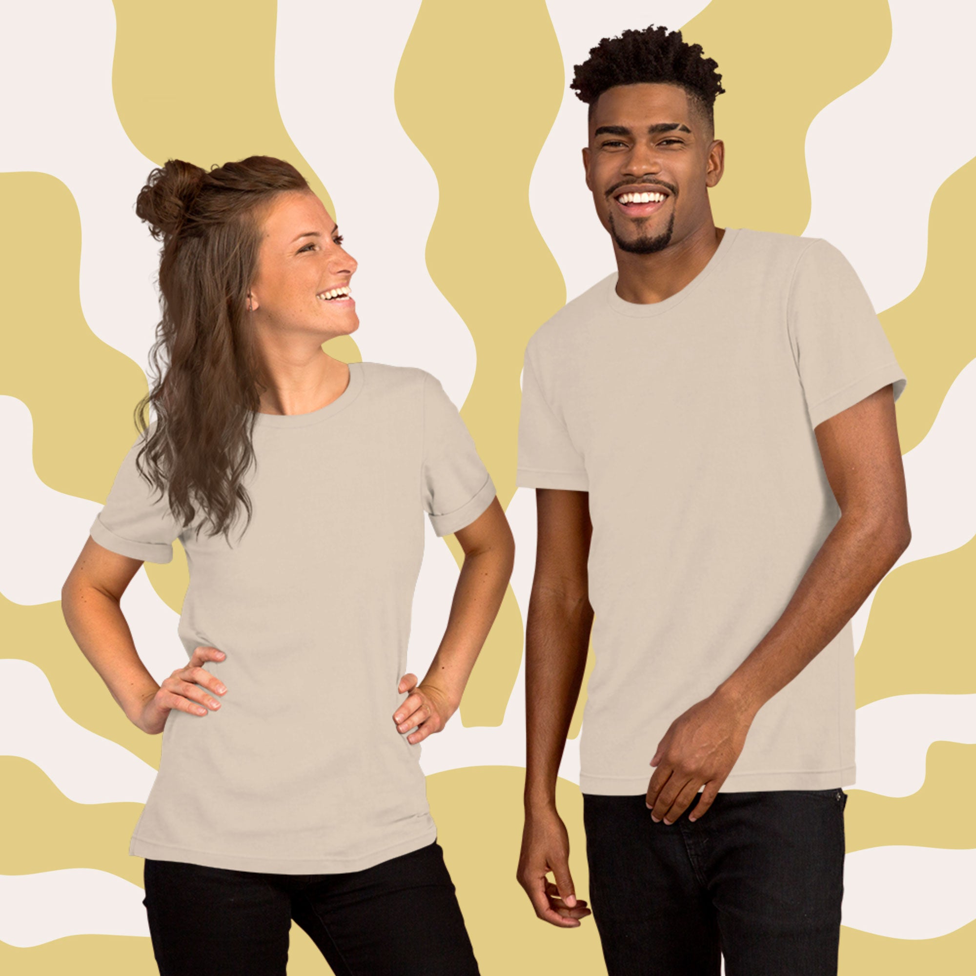 A man and a woman wearing beige t-shirts against a yellow and white abstract patterned background
