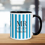 Mug with blue and white striped design and 'MR NEVER WRONG' text on a wooden surface.
