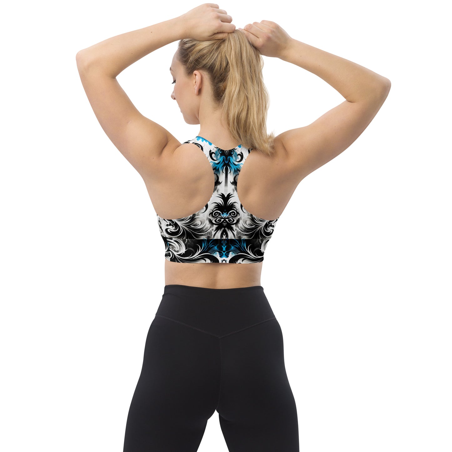 Model wearing the Ghostly Glimmer Longline Sports Bra highlighting its back design.