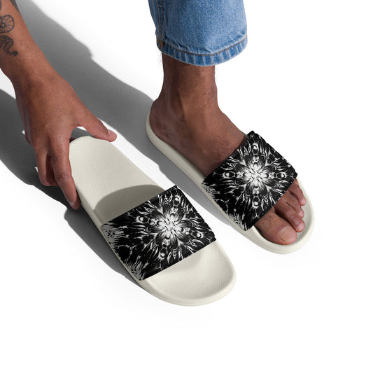 Man wearing Men’s Slides in Galactic Splash, featuring a stunning black and white galaxy-inspired design and cushioned footbed, perfect for summer activities.