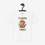 White t-shirt with a dinosaur graphic and text on a hanger against a white background