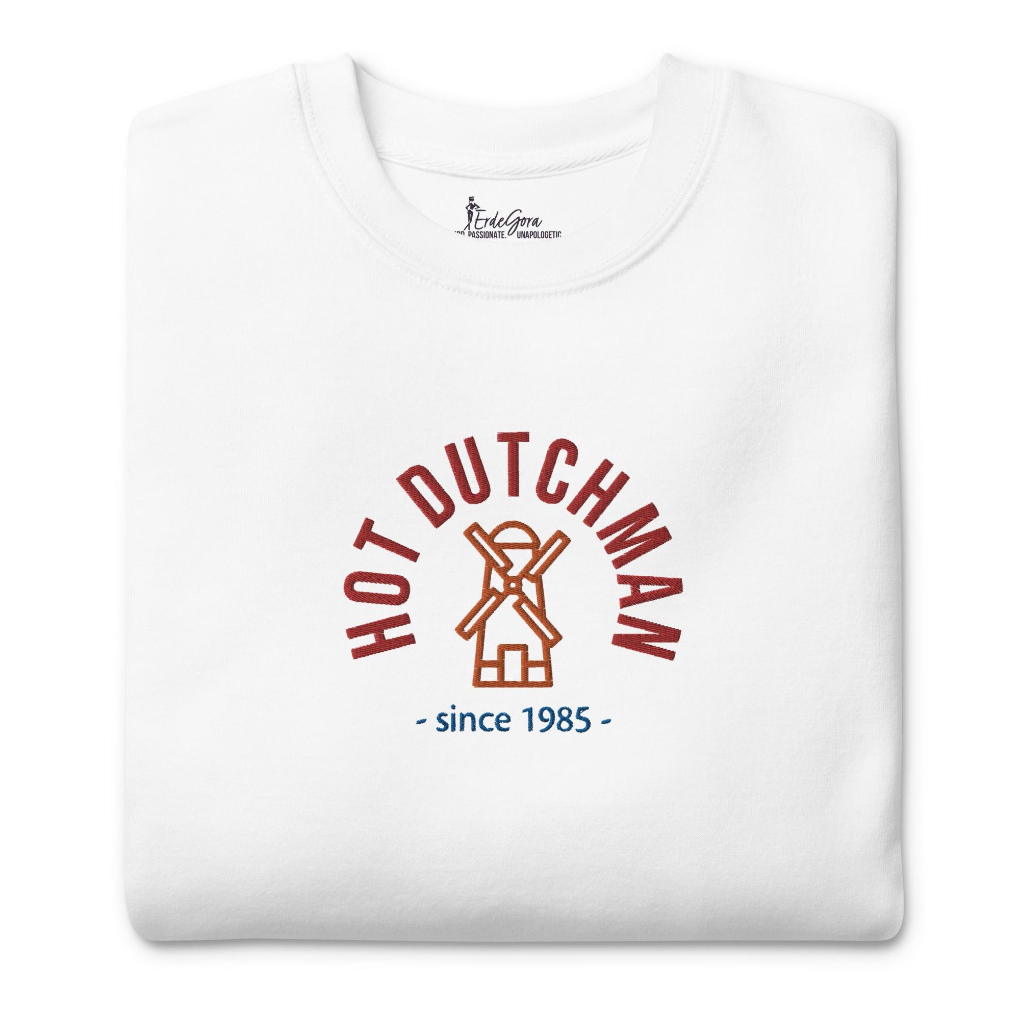 front view of the packed sweather to showcase the embroidery design of a windmill in orange, top written in red hot dutchman and under in blue since 1985, the year is customizable.