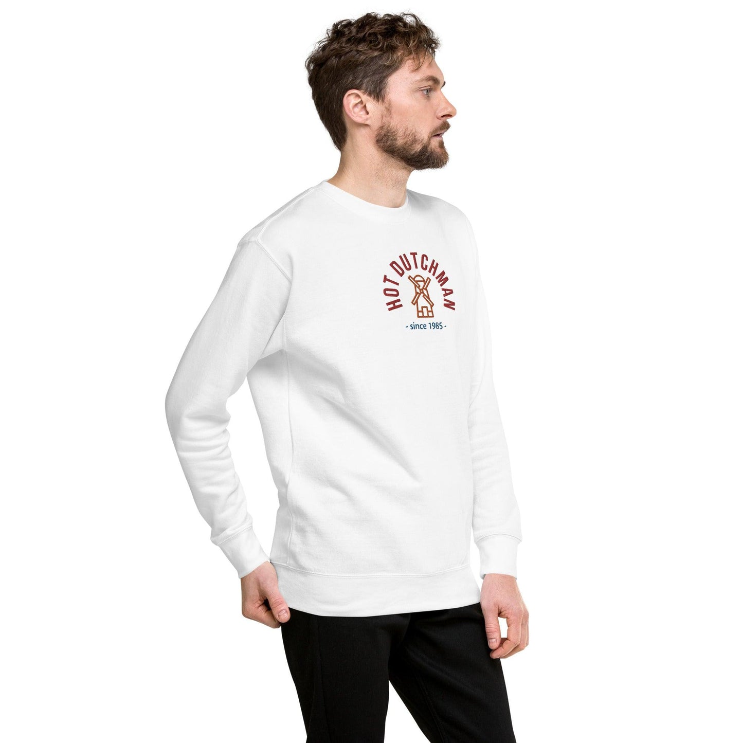 man in white sweatshirt , right front view, design a windmill simple embroidery in orange, top written in red hot dutchman and under in blue since 1985, the year is customizable.