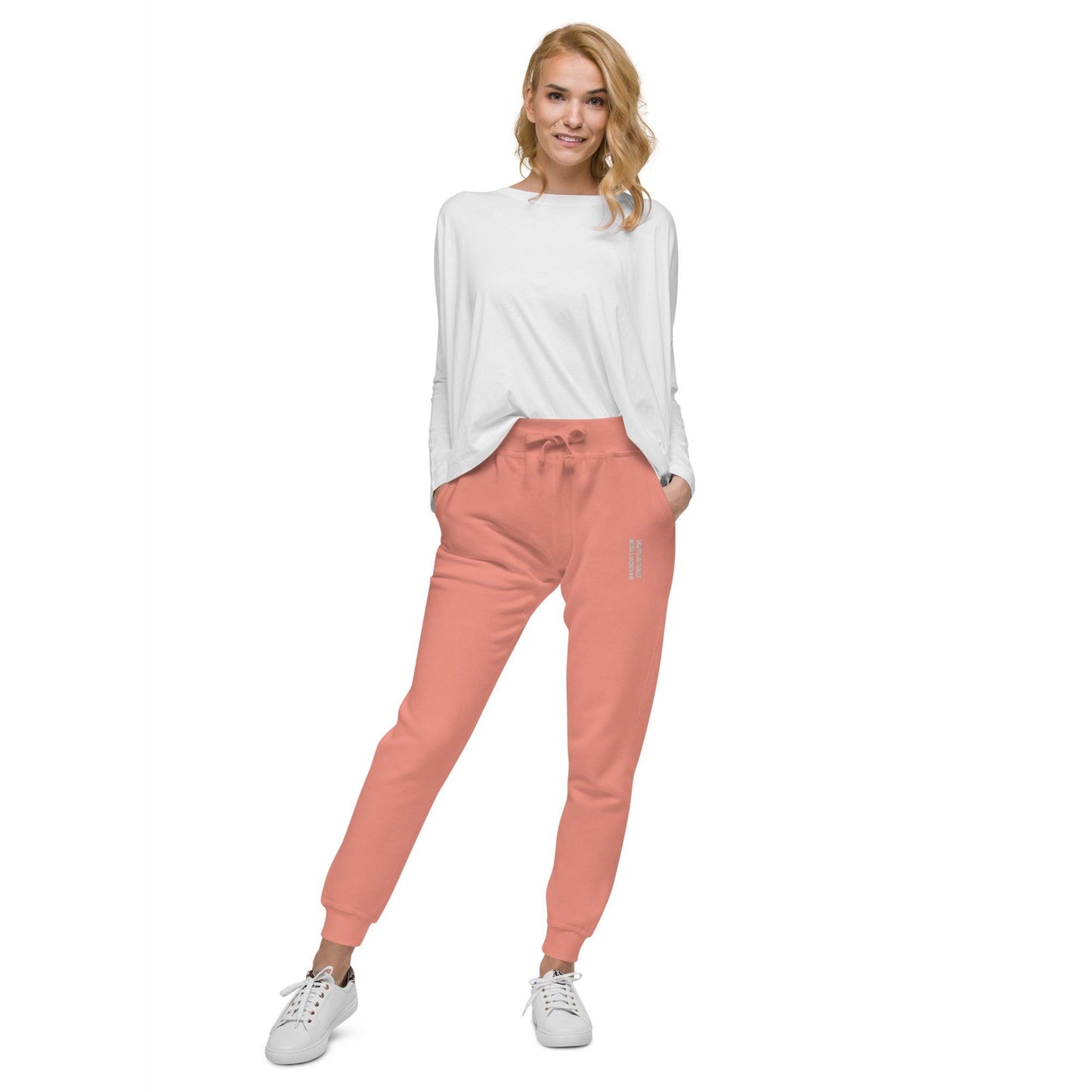 unisex fleece sweatpants shown on a woman, dusty rose color, front view.