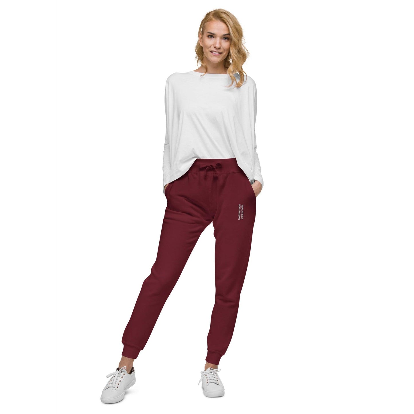 unisex fleece sweatpants shown on a woman, maroon color, front view.