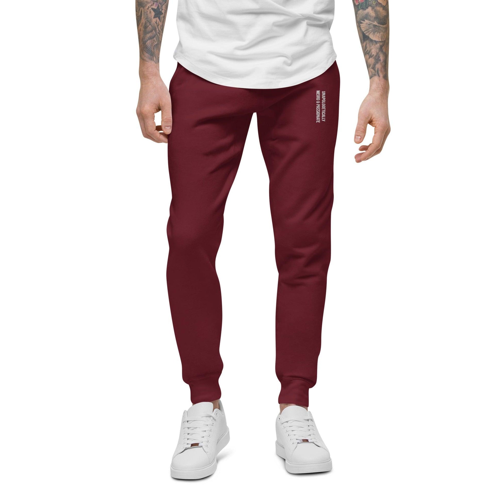 unisex fleece sweatpants shown on a man, maroon color, front view.