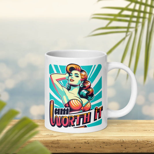 A colorful pinup girl in orange, blue, and pink, printed on a glossy white 20 oz mug, with the text 'I AM WORTH IT'.